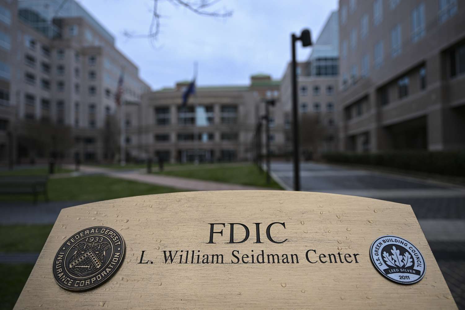 Street view of FDIC building showing building sign in the foreground