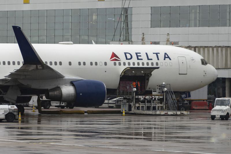 A Delta Air Lines Boeing 767-300 at an airport gate