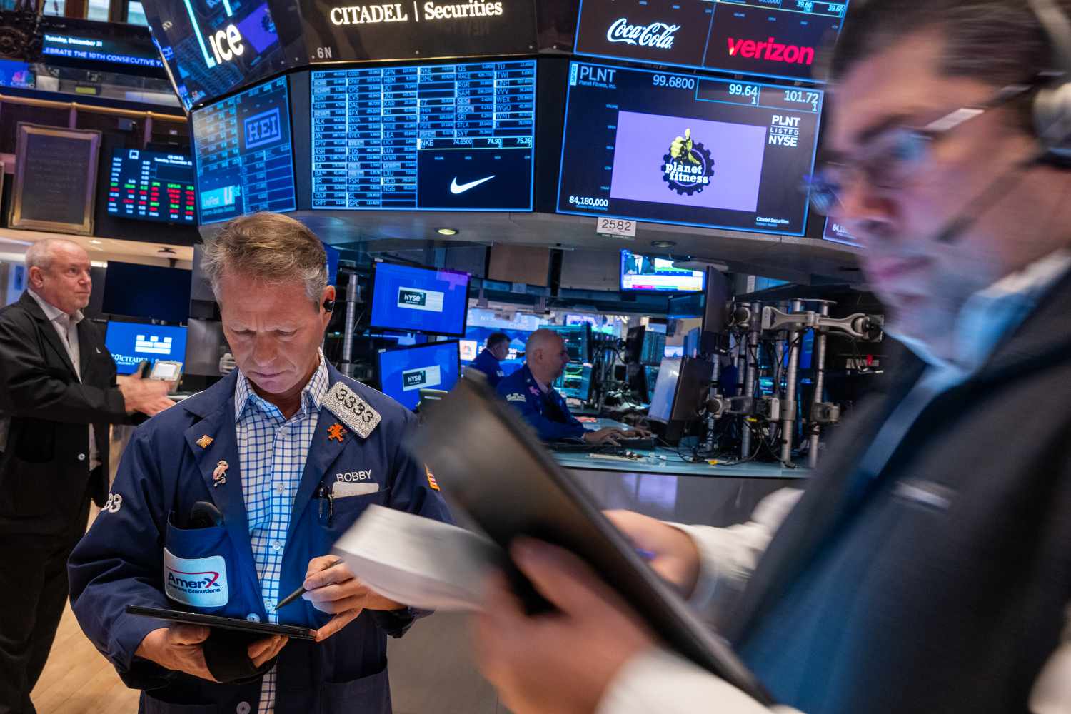 Traders work on the floor of the New York Stock Exchange