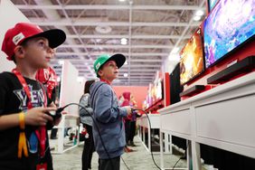 Brothers try out a Nintendo Switch 2. 