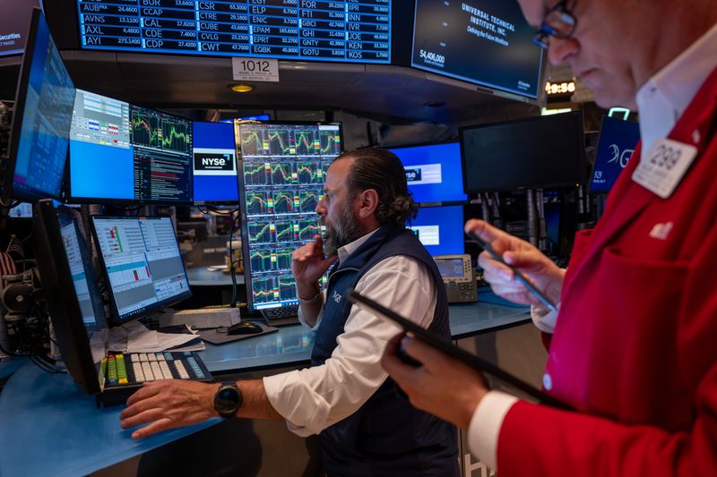 Traders work on the floor of the New York Stock Exchange (NYSE) on May 19, 2025 in New York City.
