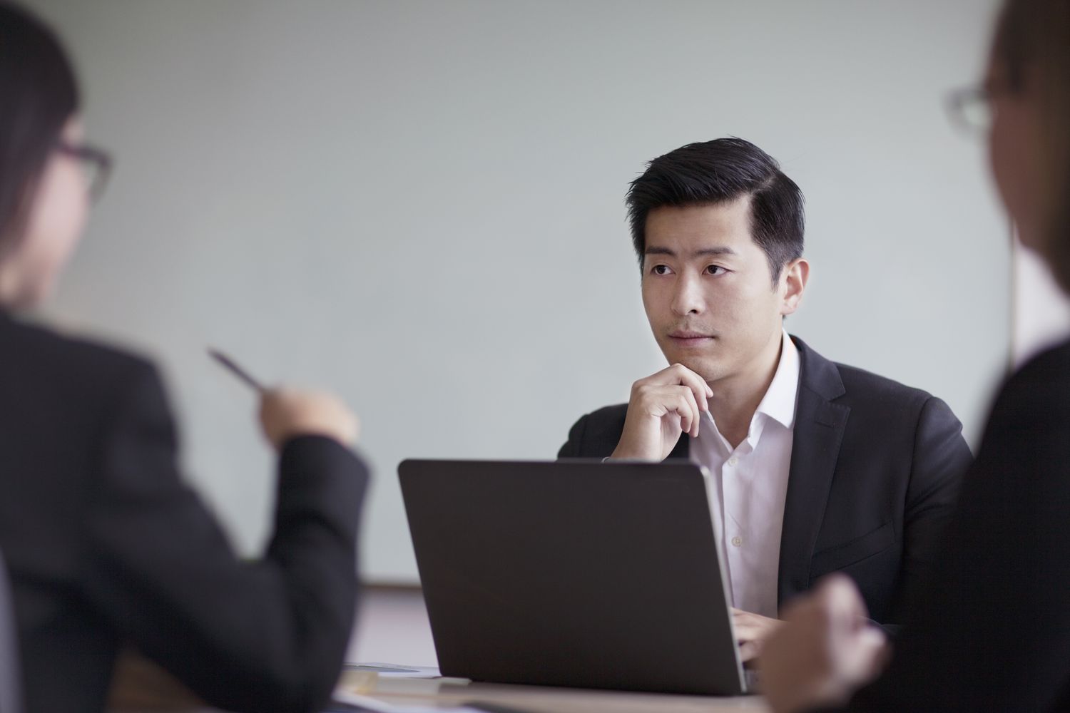 Man in a suit at a table