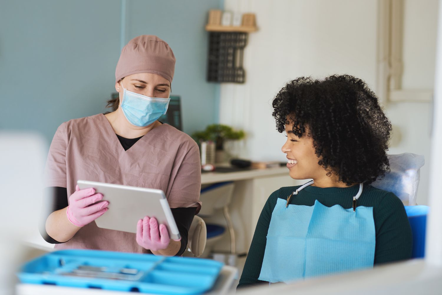 Female dentist during a consultation with her patient