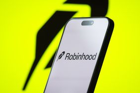 The logo of Robinhood Markets, Inc. is displayed on a smartphone screen, with the company's bright green branding visible in the background