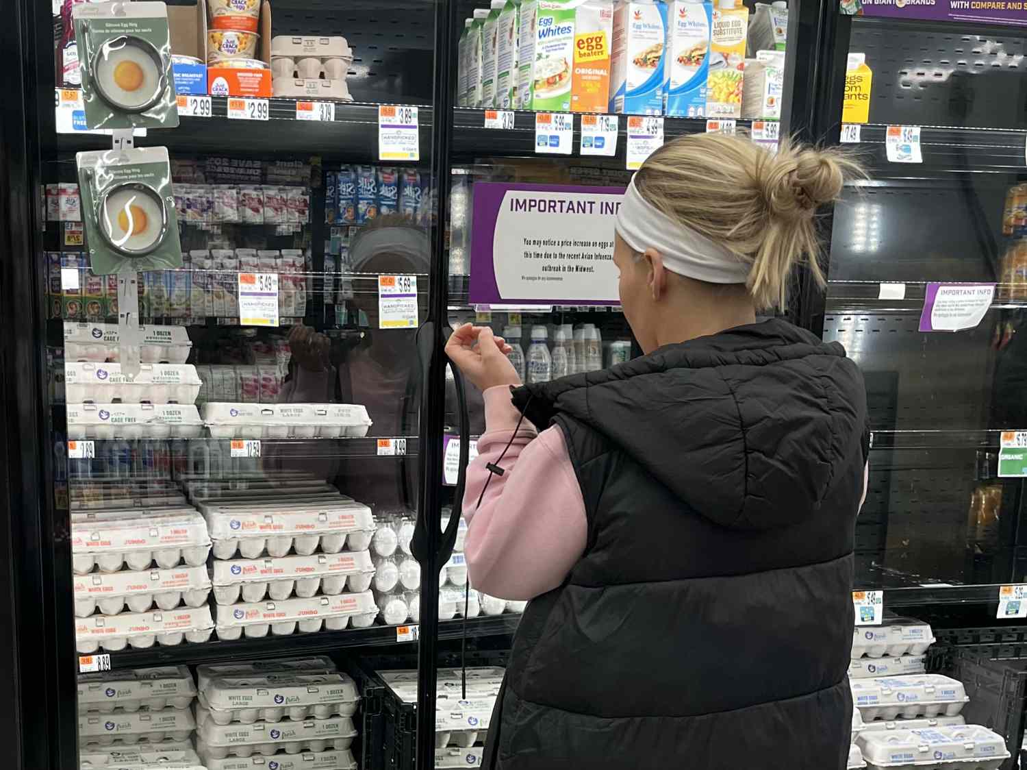A woman looks at eggs for sale in a Giant grocery store in McLean, Virginia