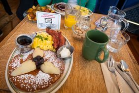 The French restaurant "La Note," gives notice and charges a "temporary egg/surcharge" of $.50 per egg, due to the high cost of eggs, in Berkeley, California, photographed March 15, 2025.