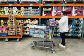 A woman shops for items at a Costco store.
