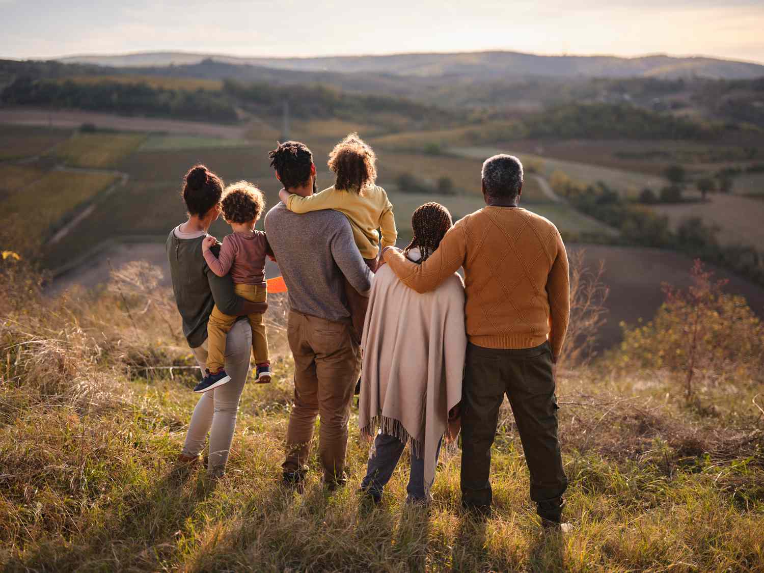 Family looking out onto a hill