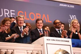 Employees and executives from Venture Global ring the opening bell of the New York Stock Exchange, with the Venture Global logo visible in the backrgound