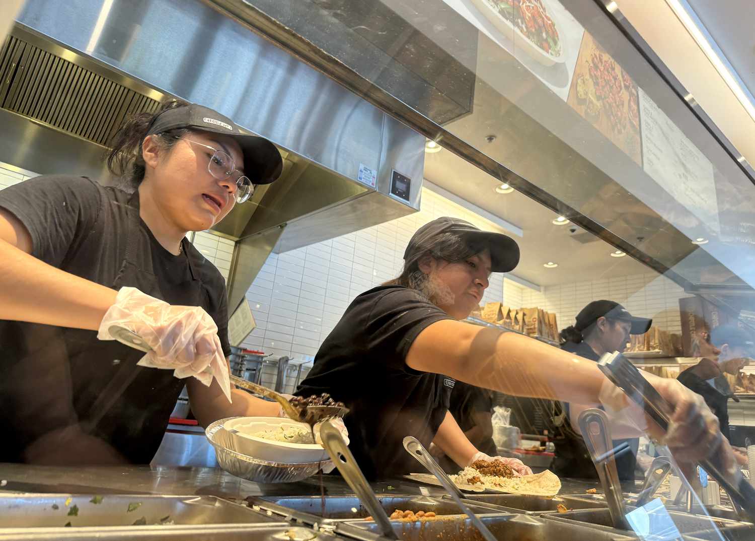 Workers at a San Rafael, California, Chipotle restaurant in April