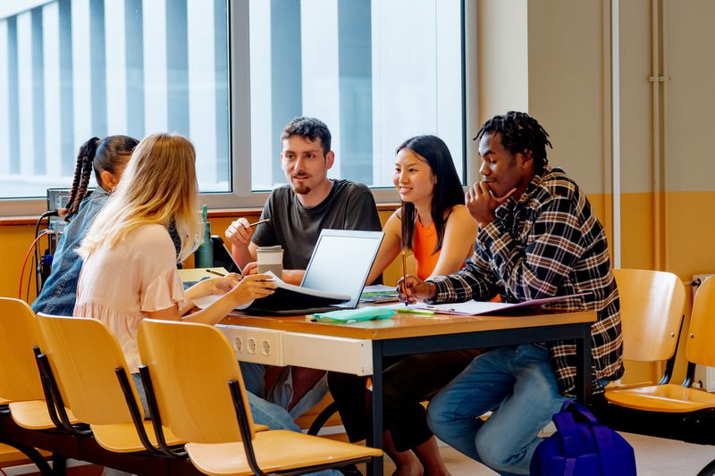 Students discussing how they can get paid to go to college