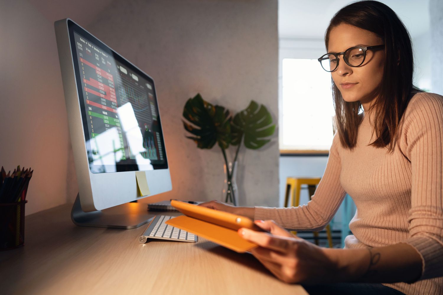 Stock trader used financial data on a computer screen to consider using rising interest yield-based options to hedge their portfolio.