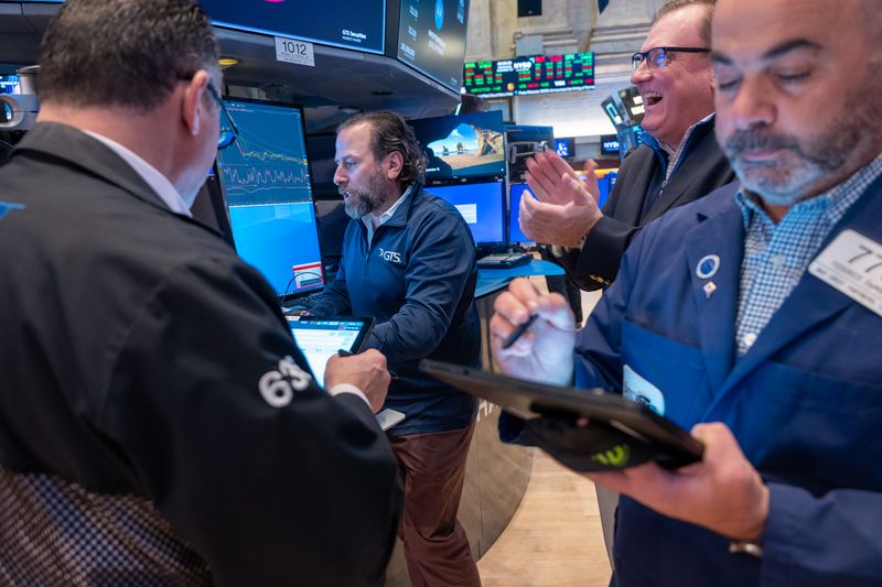 Traders work on the floor of the New York Stock Exchange (NYSE) on November 15, 2023 in New York City. The Dow was up again in morning trading after news of lower than expected inflation readings encouraged investors.