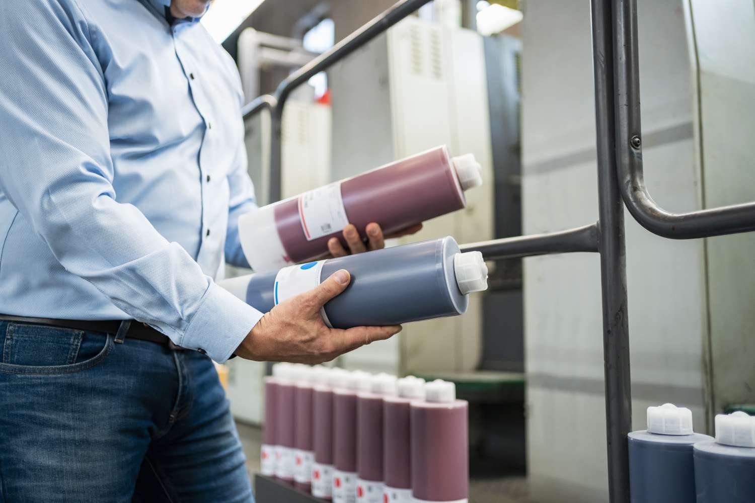 A man compares two types of ink. 