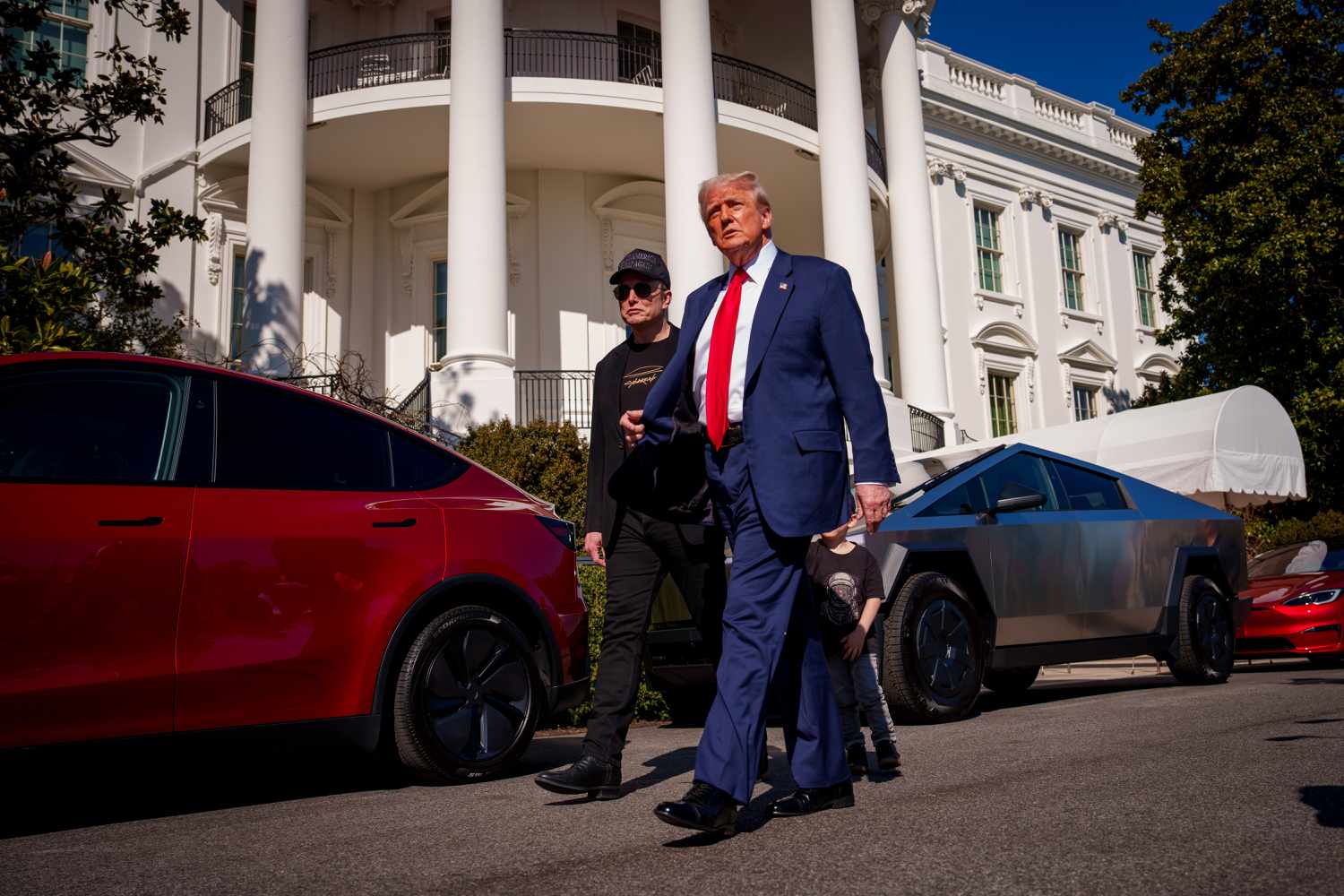 U.S. President Donald Trump and White House Senior Advisor, Tesla and SpaceX CEO Elon Musk depart after looking at Tesla vehicles on the South Lawn of the White House