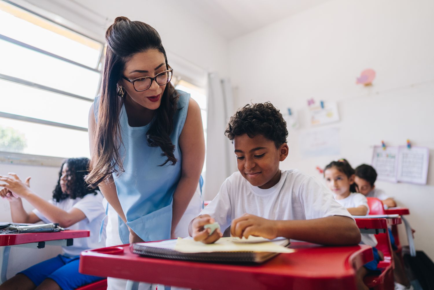 Teacher helping student