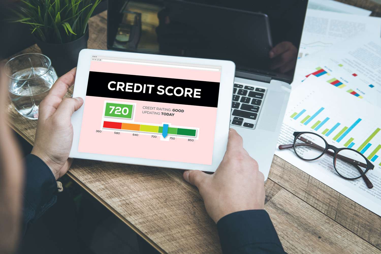 A person looking at their own credit score and looking for lenders that use VantageScore instead of FICO.