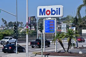Vehicles pass an ExxonMobil gas station on September 23, 2024 in Rosemead, California