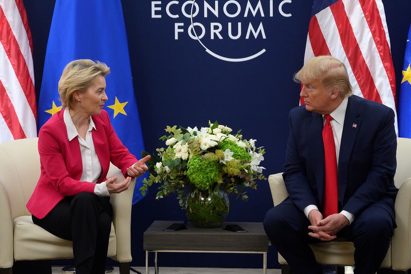 European Commission President Ursula von der Leyen and U.S. President Donald Trump speak while seated in chairs.
