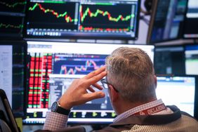 A trader works on the floor at the New York Stock Exchange.