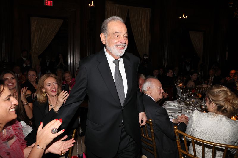 Honoree Carlos Slim HelÃÂº walks to the stage during the Sophia Awards of Excellence