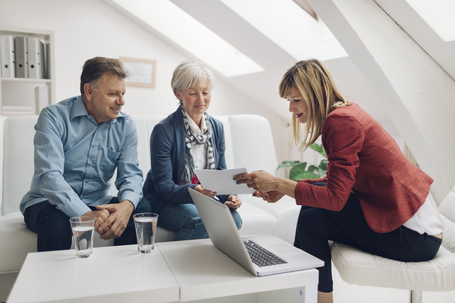 Older couple speaking with a mortgage originator