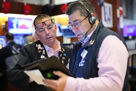  Traders work on the floor of the New York Stock Exchange during morning trading on May 07, 2025 in New York City. 
