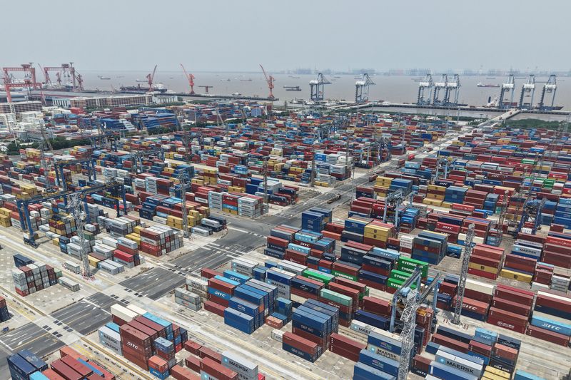An aerial view shows foreign trade containers piled up at a container terminal in Shanghai Port, China, on May 5, 2025. 