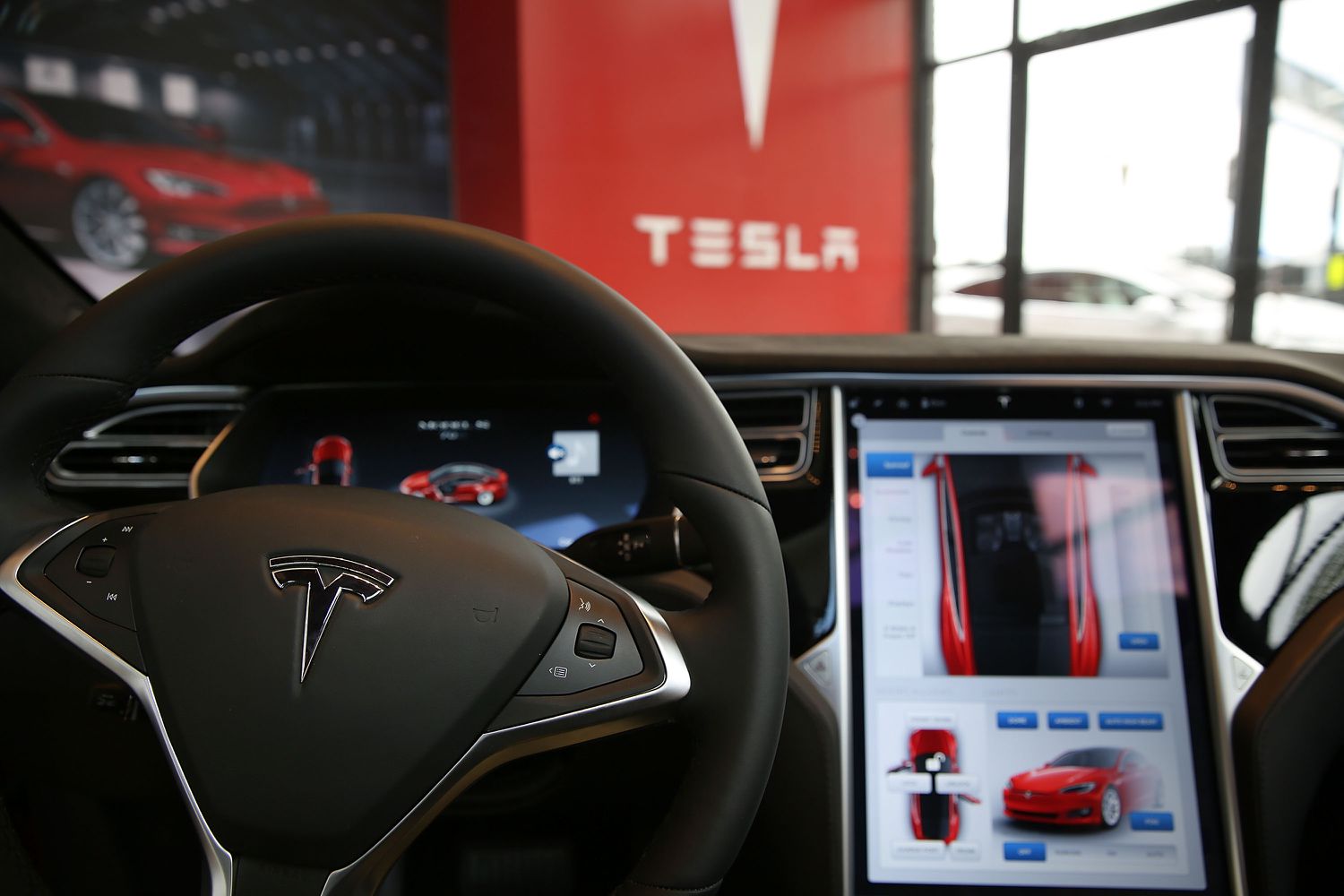 The inside of a Tesla vehicle is viewed as it sits parked in a new Tesla showroom and service center in Red Hook, Brooklyn on July 5, 2016 in New York City.