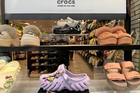 A Crocs show display in a store window