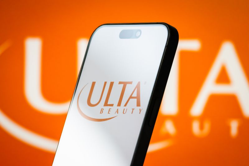 The logo of Ulta Beauty is displayed on a smartphone screen, with the company's signature orange branding visible in the background