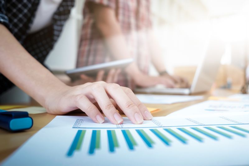 Close-Up Of Hand Of Business Analyst