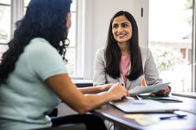 Women meeting in business office about CD rates