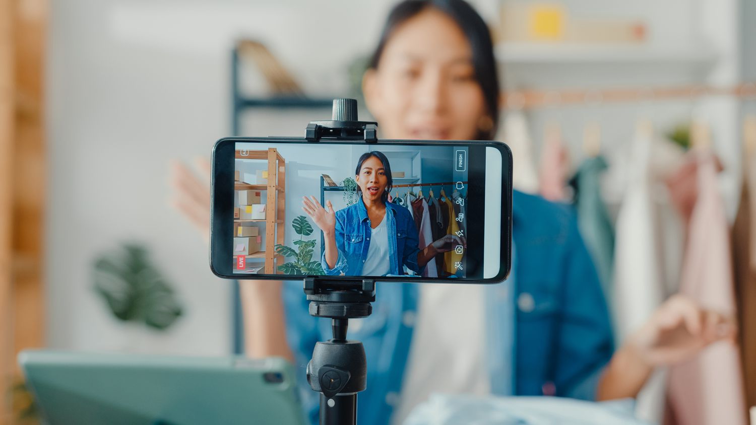 Woman recording herself at home on phone