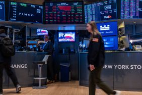 raders work on the floor of the New York Stock Exchange