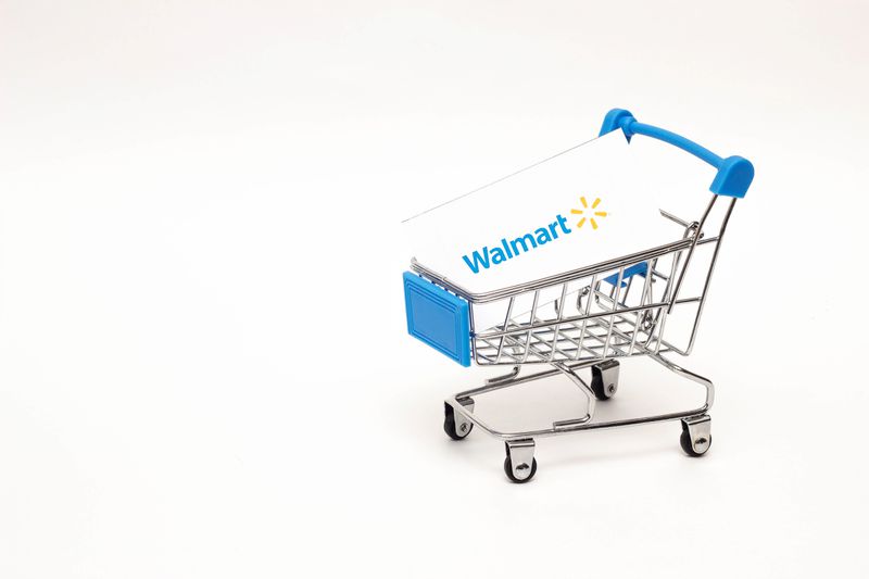 Shopping trolley with a Walmart card on a white background.