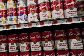 Cans of Campbell soup are displayed