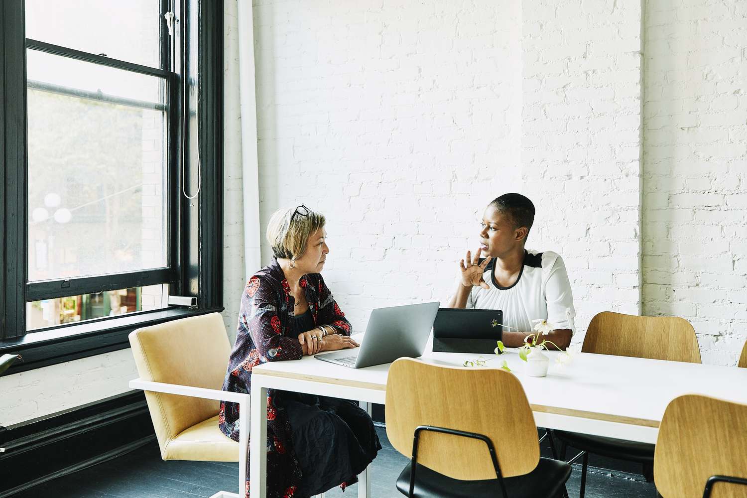 Businesswoman meeting with financial advisor in office conference room