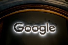 An image of Google's logo in white light against a dark background.