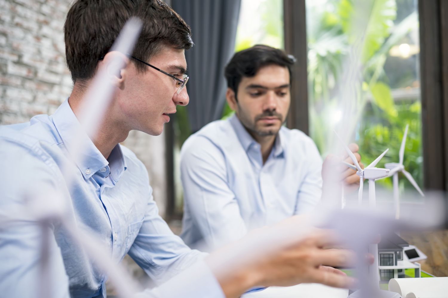 Two business colleagues discussing company products in an office