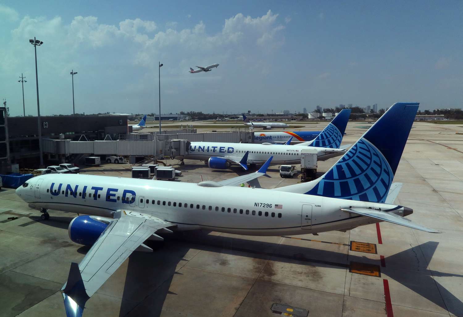 A United Airlines airplane arrives at a gate.