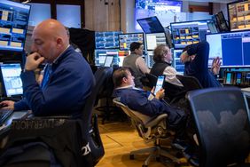 Traders work on the floor of the New York Stock Exchange