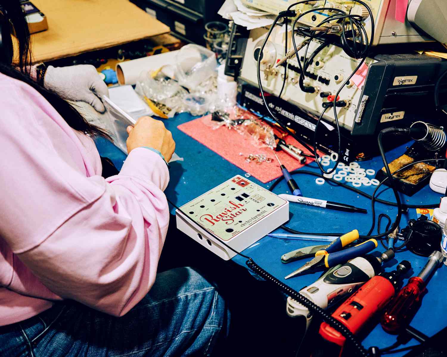 A worker assembles the Ravish Sitar Emulator pedal at the Electro-Harmonix's manufacturing facility in the Queens borough of New York, US, on Thursday, March 6, 2025.