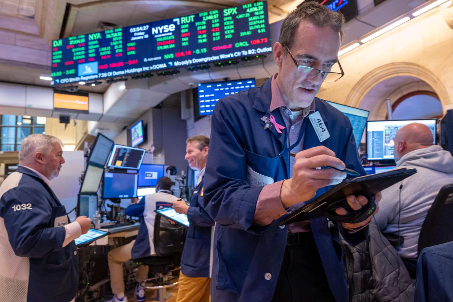 Traders work on the floor of the New York Stock Exchange (NYSE) on January 19, 2024.