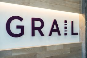 The Grail logo is seen on a white wall.