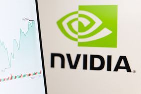 Stock market information seen displayed on a smartphone with a Nvidia Corporation logo in the background