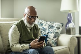 Elderly man on his phone