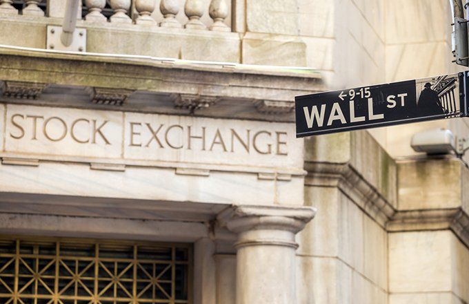 Wall Street street sign outside New York Stock Exchange
