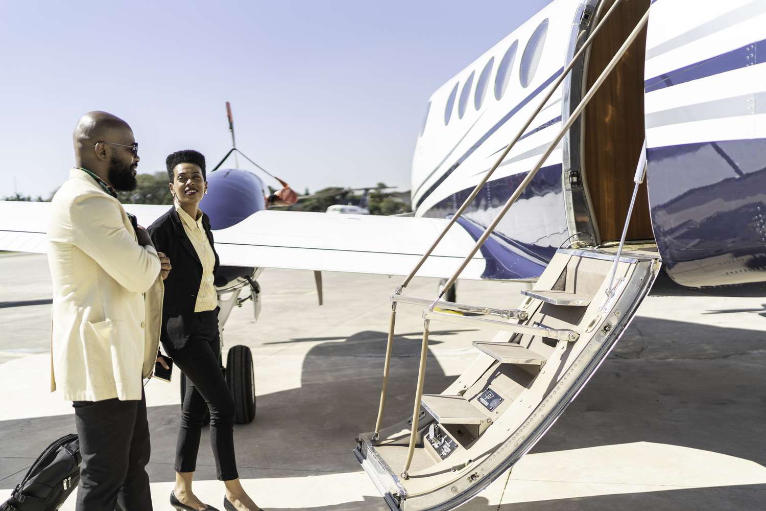 Colleagues boarding into flight in a corporate jet