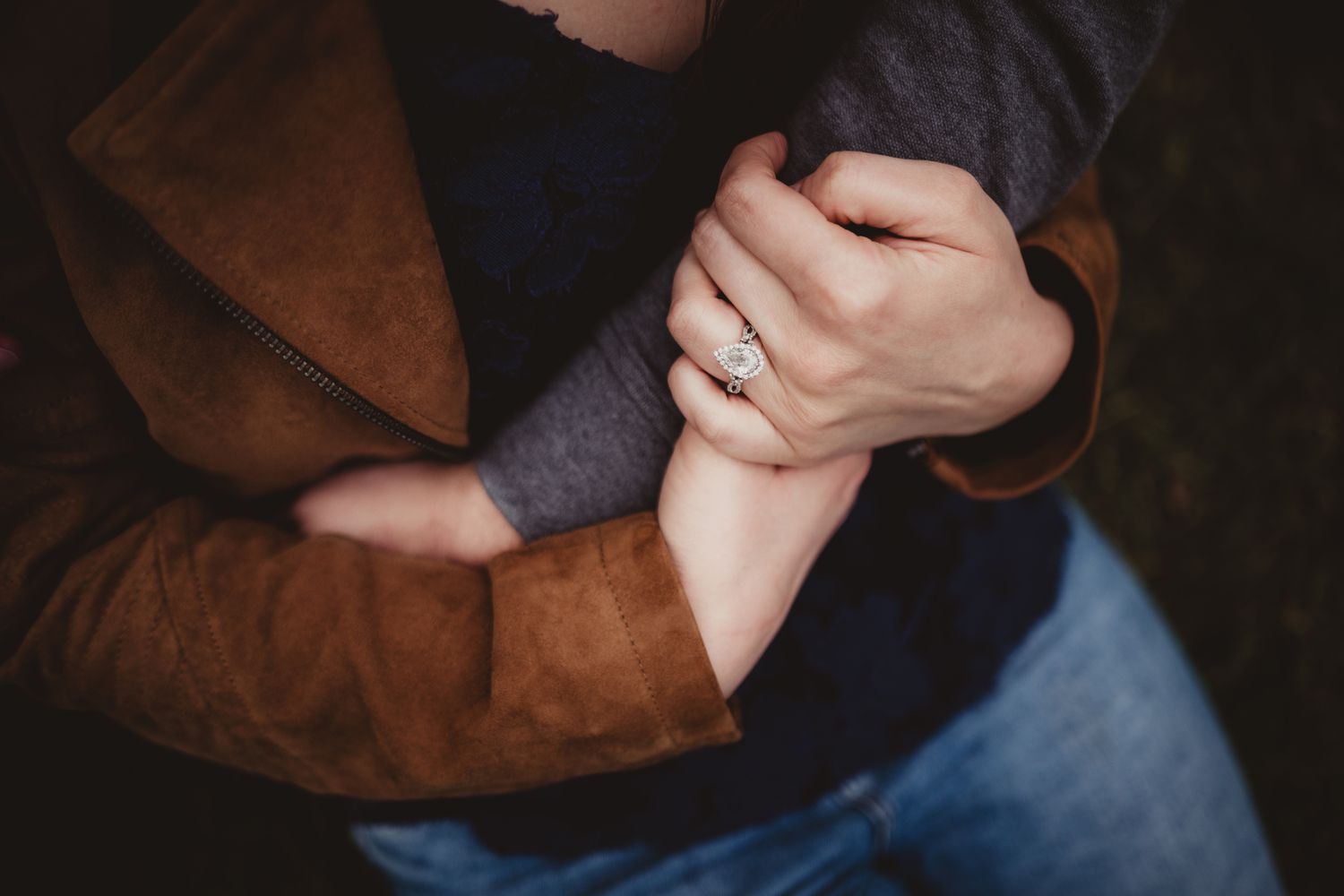 A couple with an engagement ring